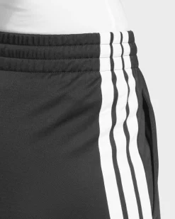 ADIDAS -PANTALONI DA TUTA DONNA NERI CON 3 BANDE BIANCHE ESSENTIALS TRICOT 3-STRIPES - JF3383