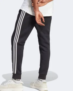 ADIDAS - PANTALONI ESSENTIALS FLEECE 3-STRIPES TAPERED CUFF - IB4030