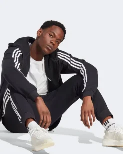 ADIDAS - PANTALONI ESSENTIALS FLEECE 3-STRIPES TAPERED CUFF - IB4030