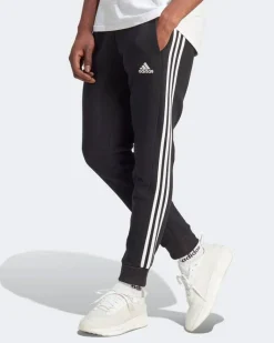 ADIDAS - PANTALONI ESSENTIALS FLEECE 3-STRIPES TAPERED CUFF - IB4030